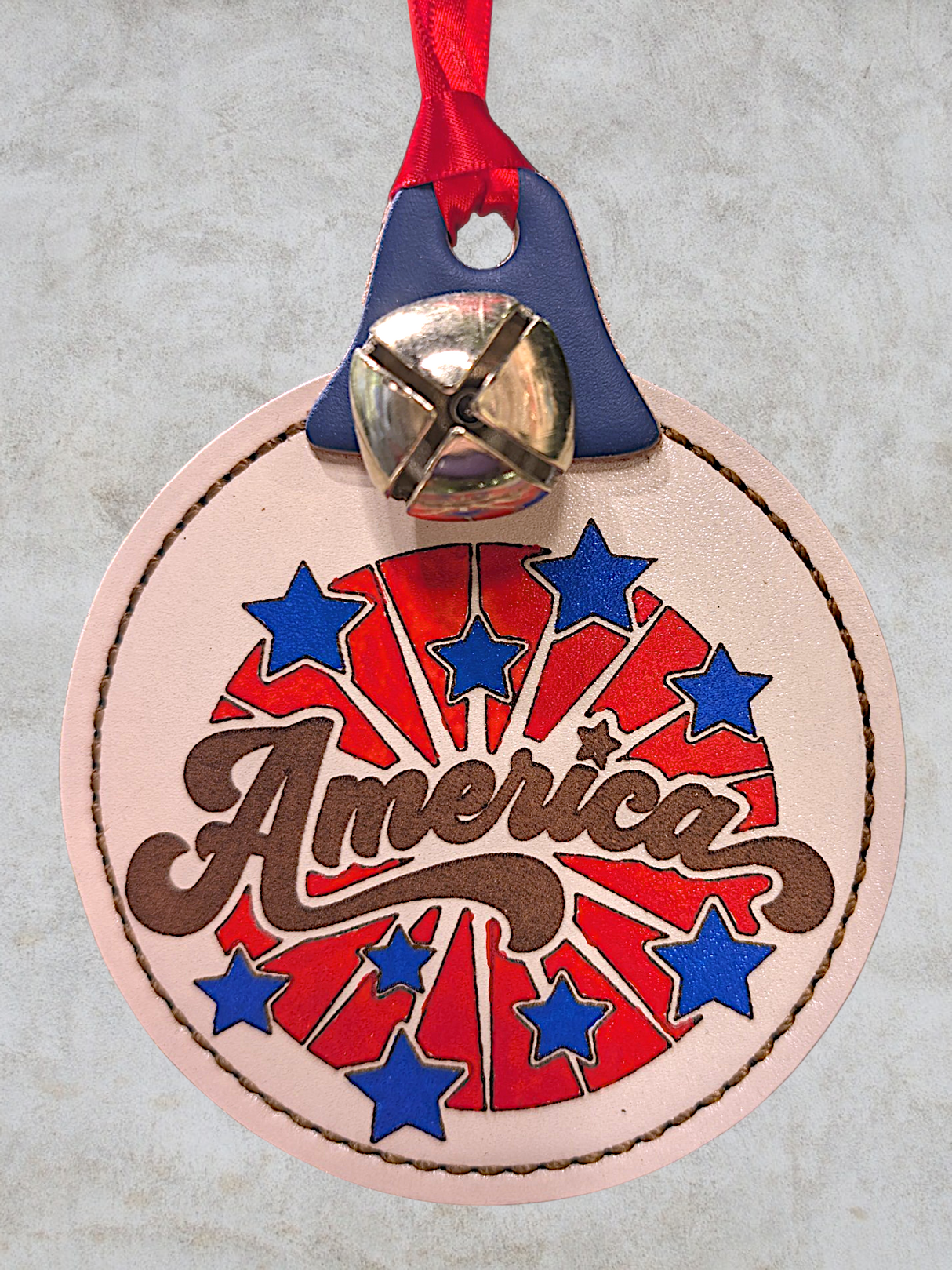Laser Engraved Leather America Starburst Ornament with Bell