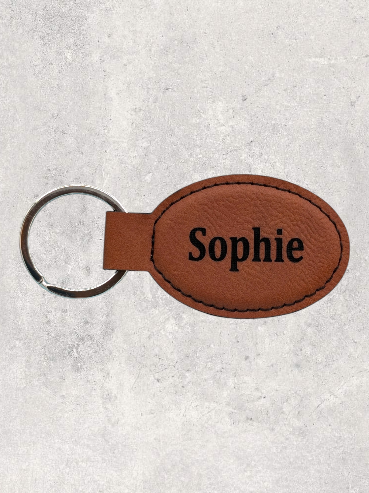 Leatherette oval personalization sample in chestnut