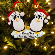 PENGUINS THROWING SNOWBALLS Ornament