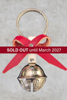 Silver Belsnickel bell doorhanger with red leather bow and straight dark red SOLD OUT until March 2027 banner